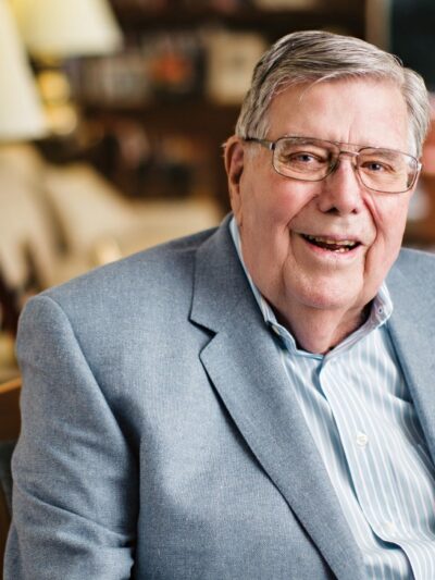 The late Dick Holland sits for a portrait. Image by Geoff Johnson — licensed for use.