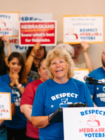 Respect Nebraska Voters sponsor Dawn Essink speaks at the podium during the turn-in press conference.
