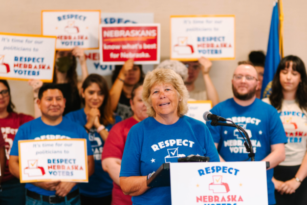 Respect Nebraska Voters sponsor Dawn Essink speaks at the podium during the turn-in press conference.