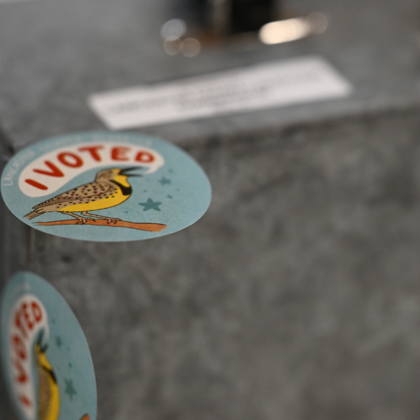 A ballot lock box includes a meadowlark sticker shouting "I Voted!"