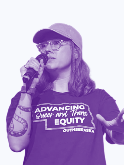 A stylized image of a speaker holding out a hand wearing a shirt reading Advancing Queer and trans equity.