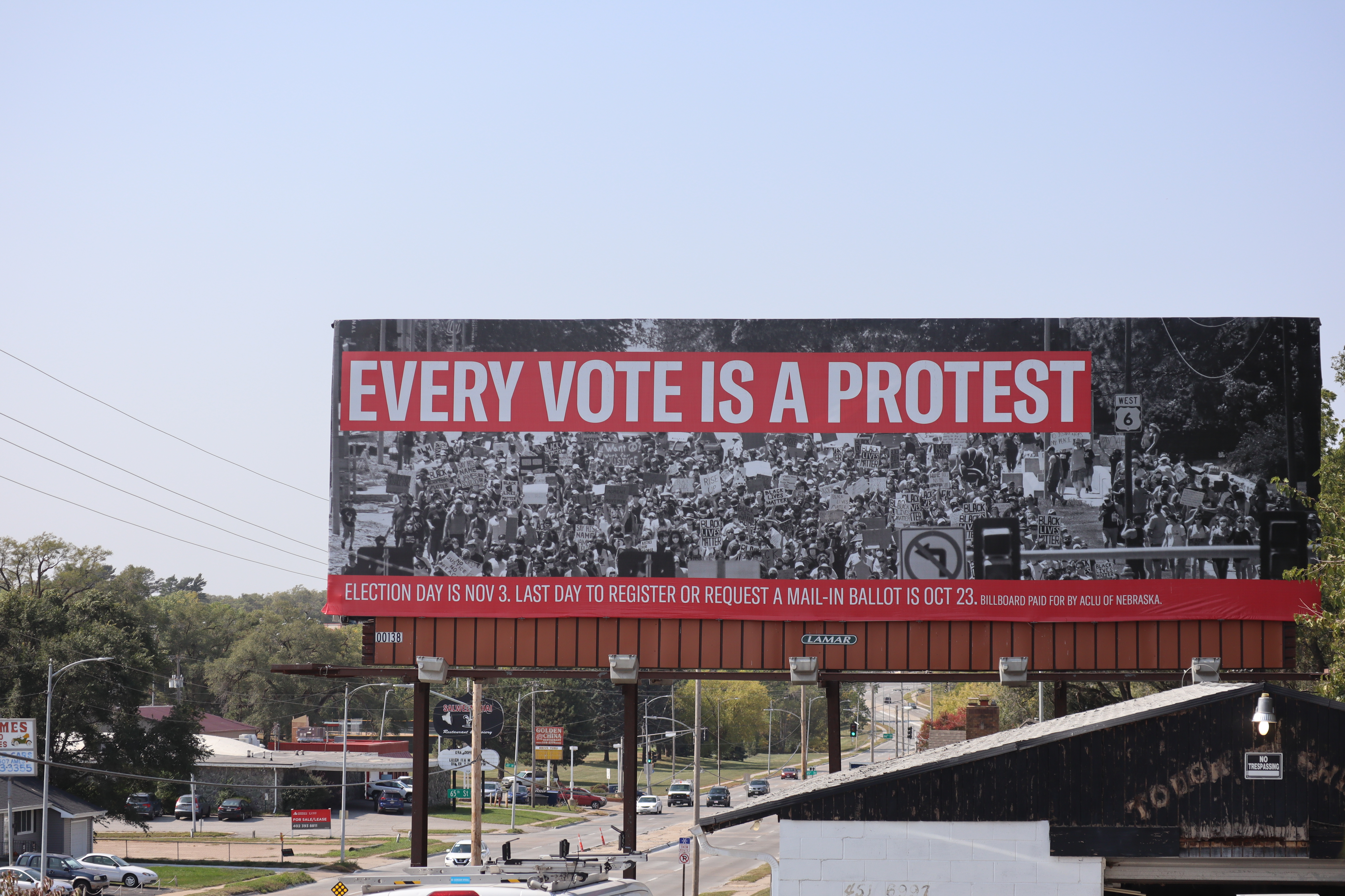 A billboard in Omaha reads "Every Vote is a Protest"