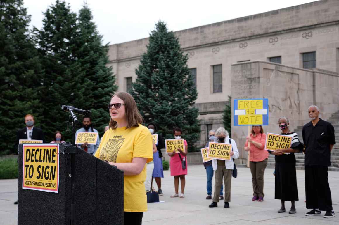 Angela Montalvo speaks at a "Decline to Sign" rally.