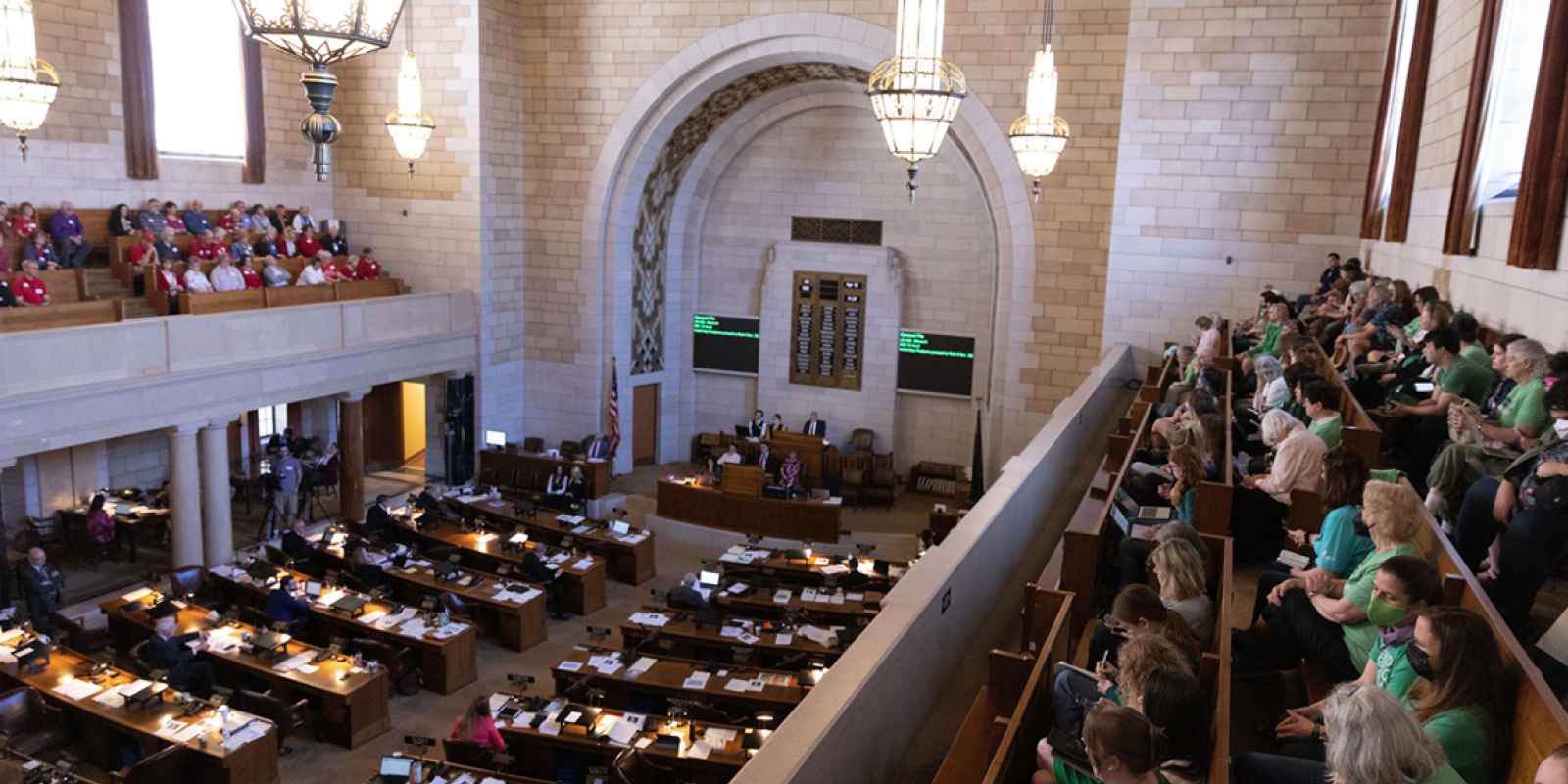 Abortion rights supporters watch debate on abortion ban LB 626 during its first round of debate.