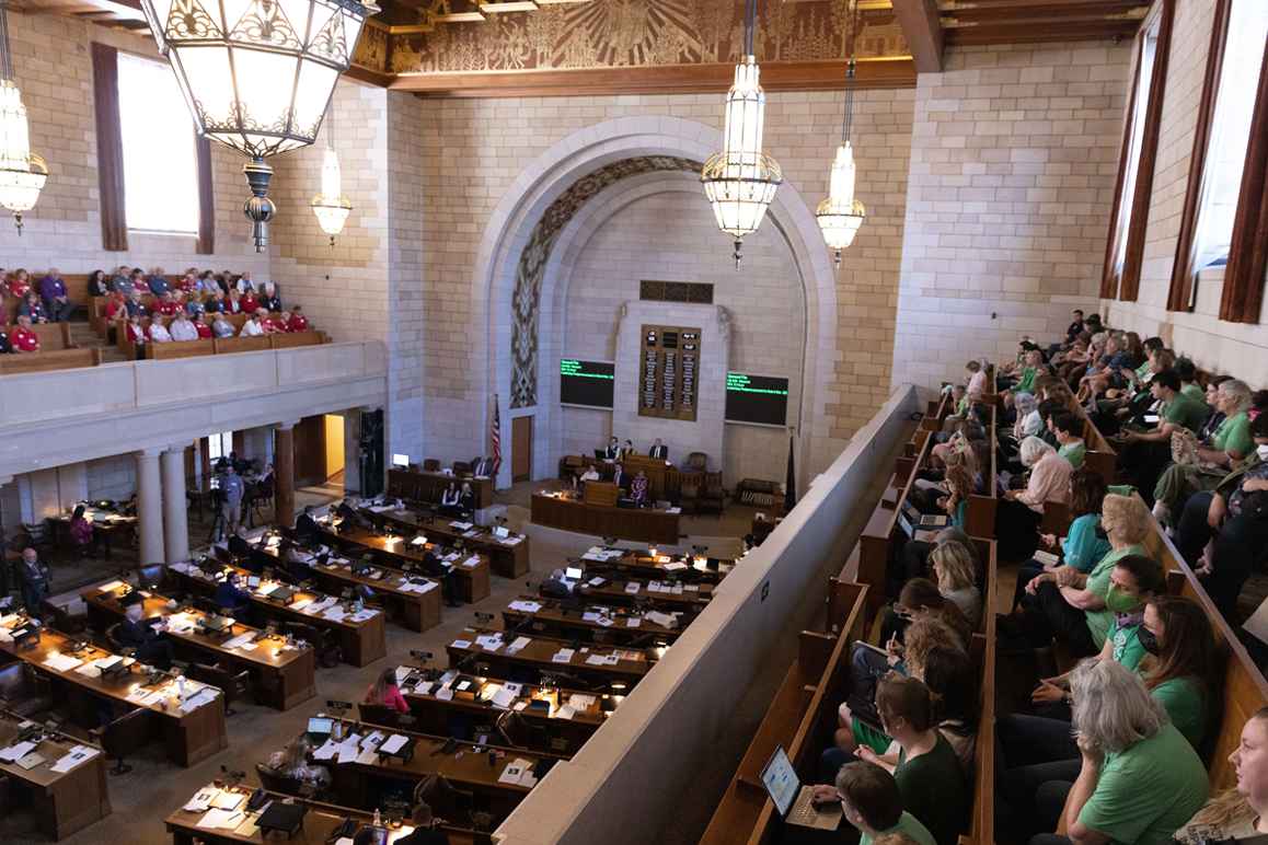 Abortion rights supporters watch debate on abortion ban LB 626 during its first round of debate.