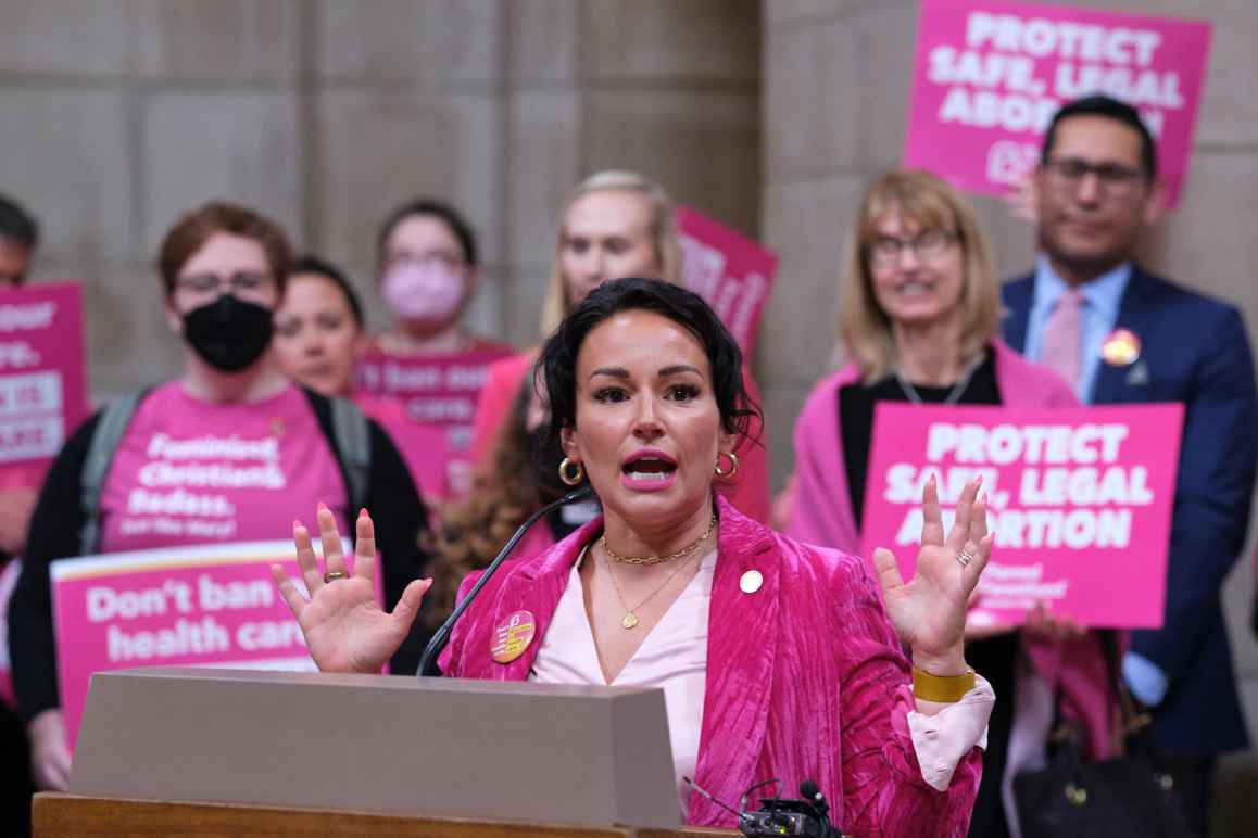 Sen. Jen Day rallies reproductive rights supporters at a press conference before debate resumed on LB933, a trigger bill.