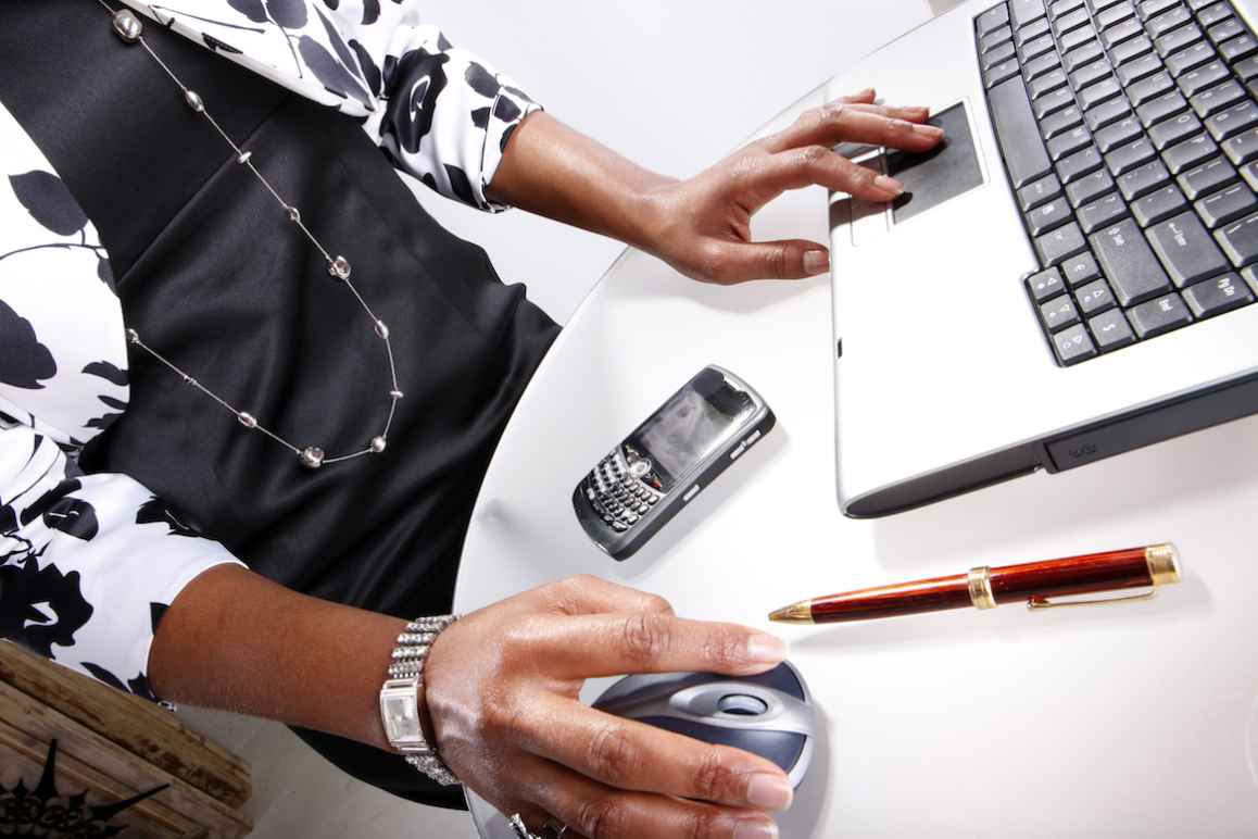 Photo of a Black woman at a computer