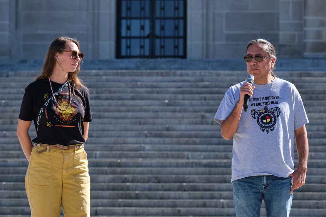 Erin Poor and Kevin Abourezk speak at a solidarity rally