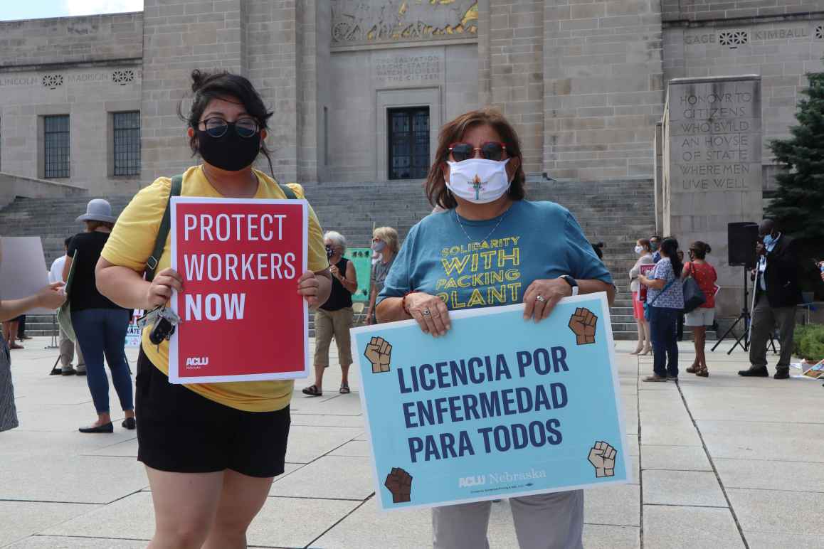 ACLU Legal & Policy Counsel Rose Godinez stands next to ACLU Board Member Yolanda Nuncio at a demonstration in support of essential workers.