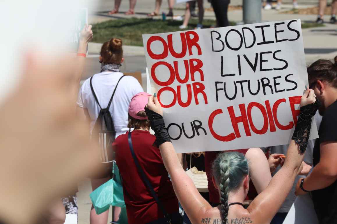 A sign reads our bodies, our lives, our futures, our choice at a July 4 abortion rights rally in Lincoln.