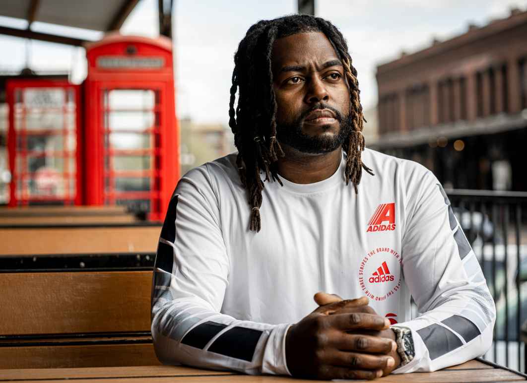 Jason Storrs sits outside in Omaha. Photograph taken by Abiola Kosoko.