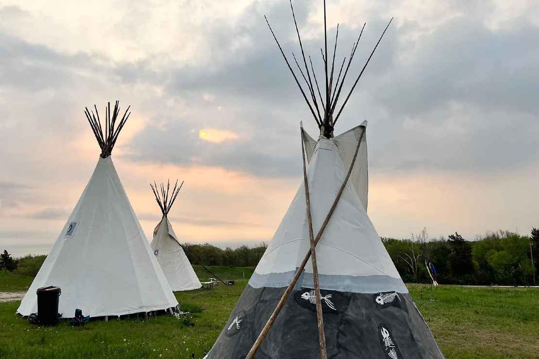 Three tipis stand at the Niskíthe Prayer Camp.