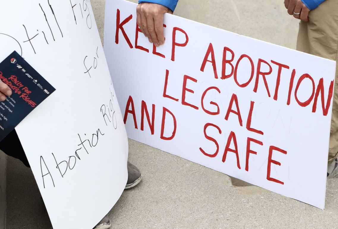 A sign reads keep abortion safe and legal.