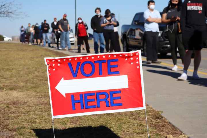 A line of Nebraskans wait to vote.