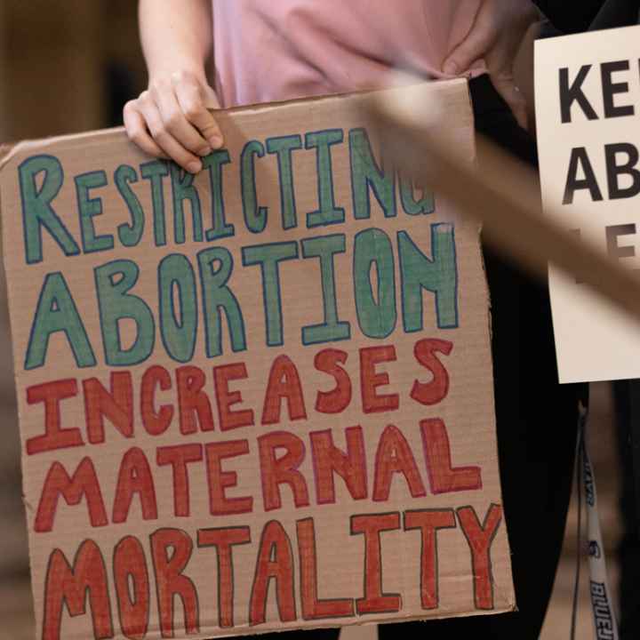 Nebraskans hold signs in support of abortion rights ahead of a committee hearing on six-week abortion ban LB 626.