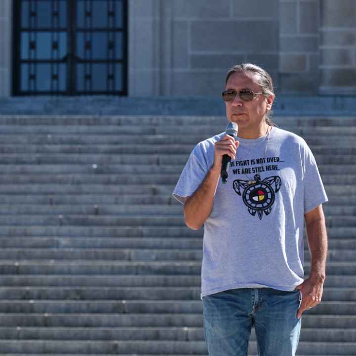 Erin Poor and Kevin Abourezk speak at a solidarity rally